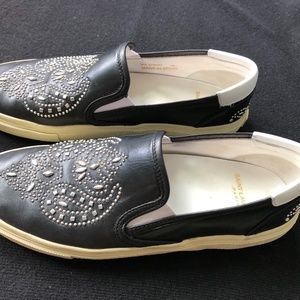 Pair of Saint Laurent, Paris leather slip-ons.